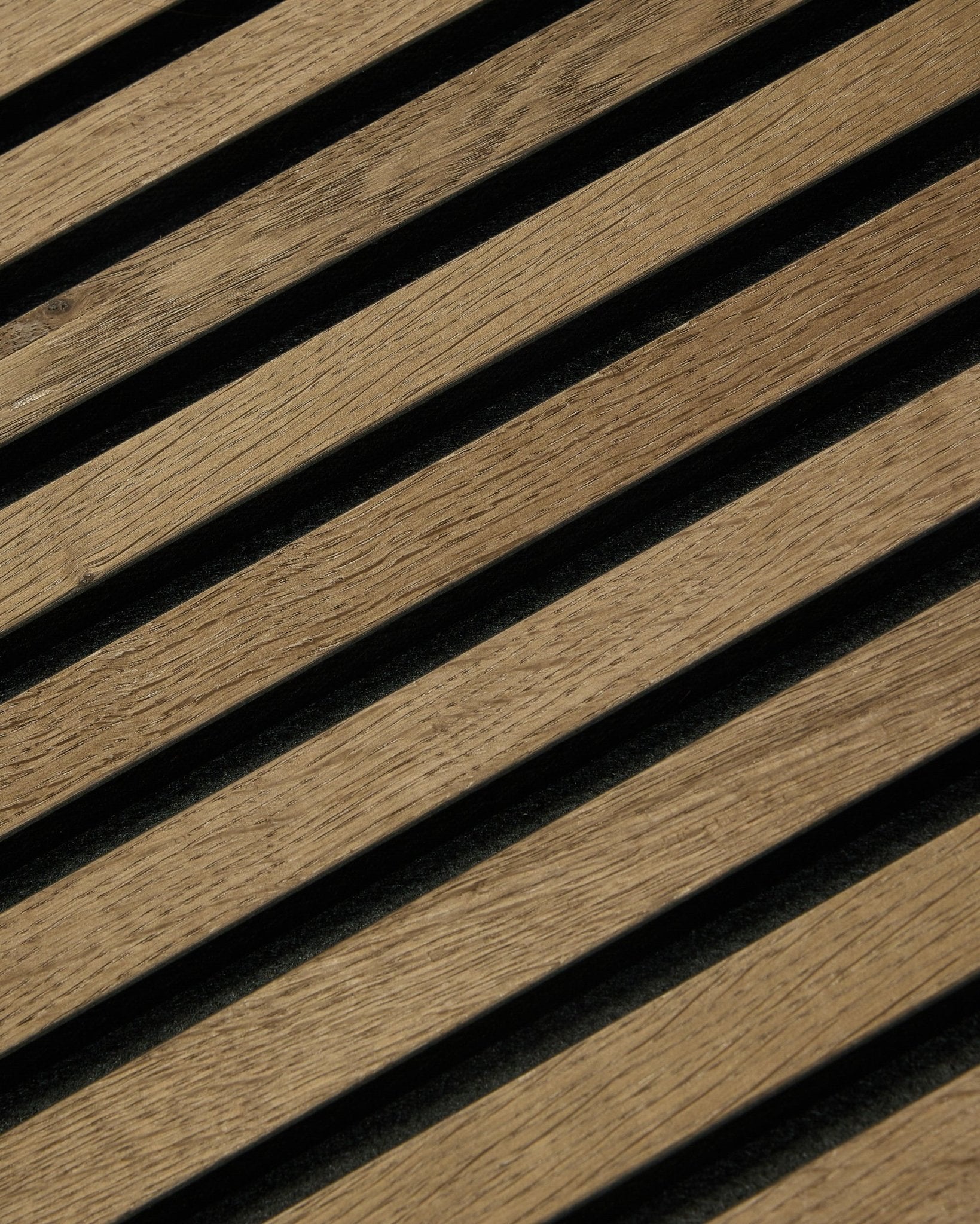 Diagonal wooden slats with dark gaps form stripes on a 60x60cm Rustic Akupixel Grey Oak acoustic panel by WoodUpp, featuring modern Scandinavian design.