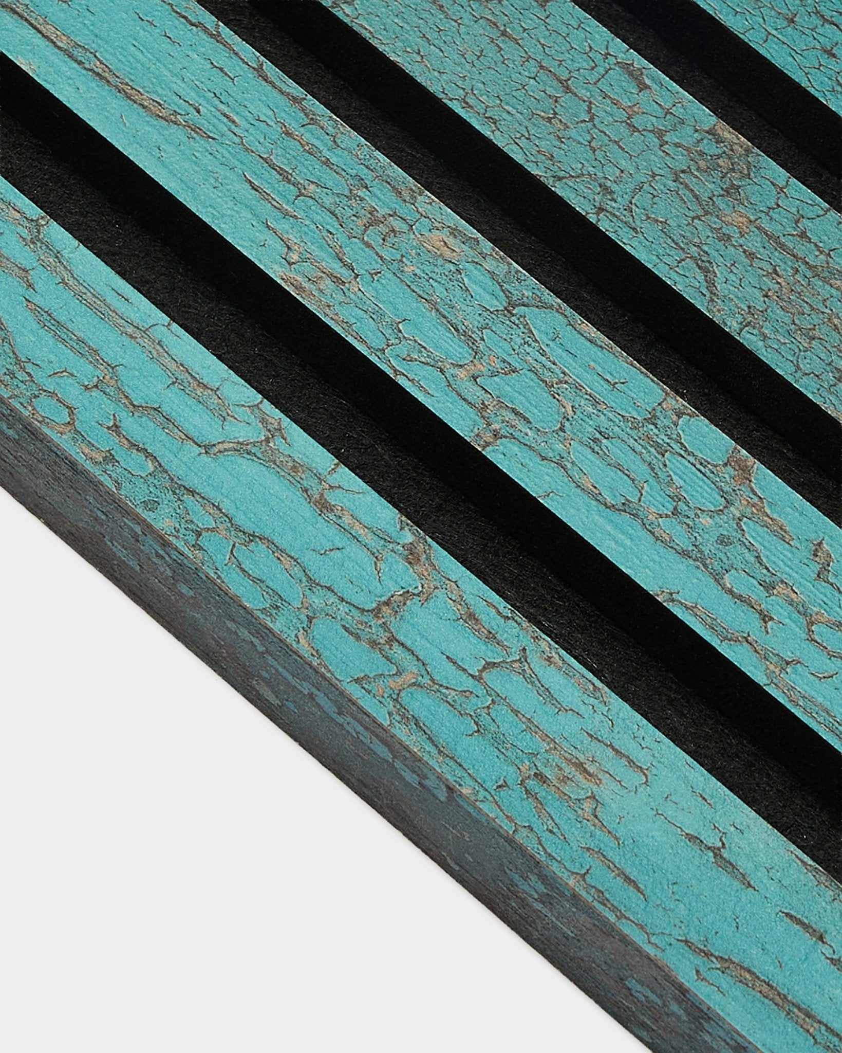 Close-up of WoodUpp Akupanel End Lamella in Oxide Blue, 2.2 cm acoustic panel with weathered Nordic texture and pronounced diagonal black grooves.
