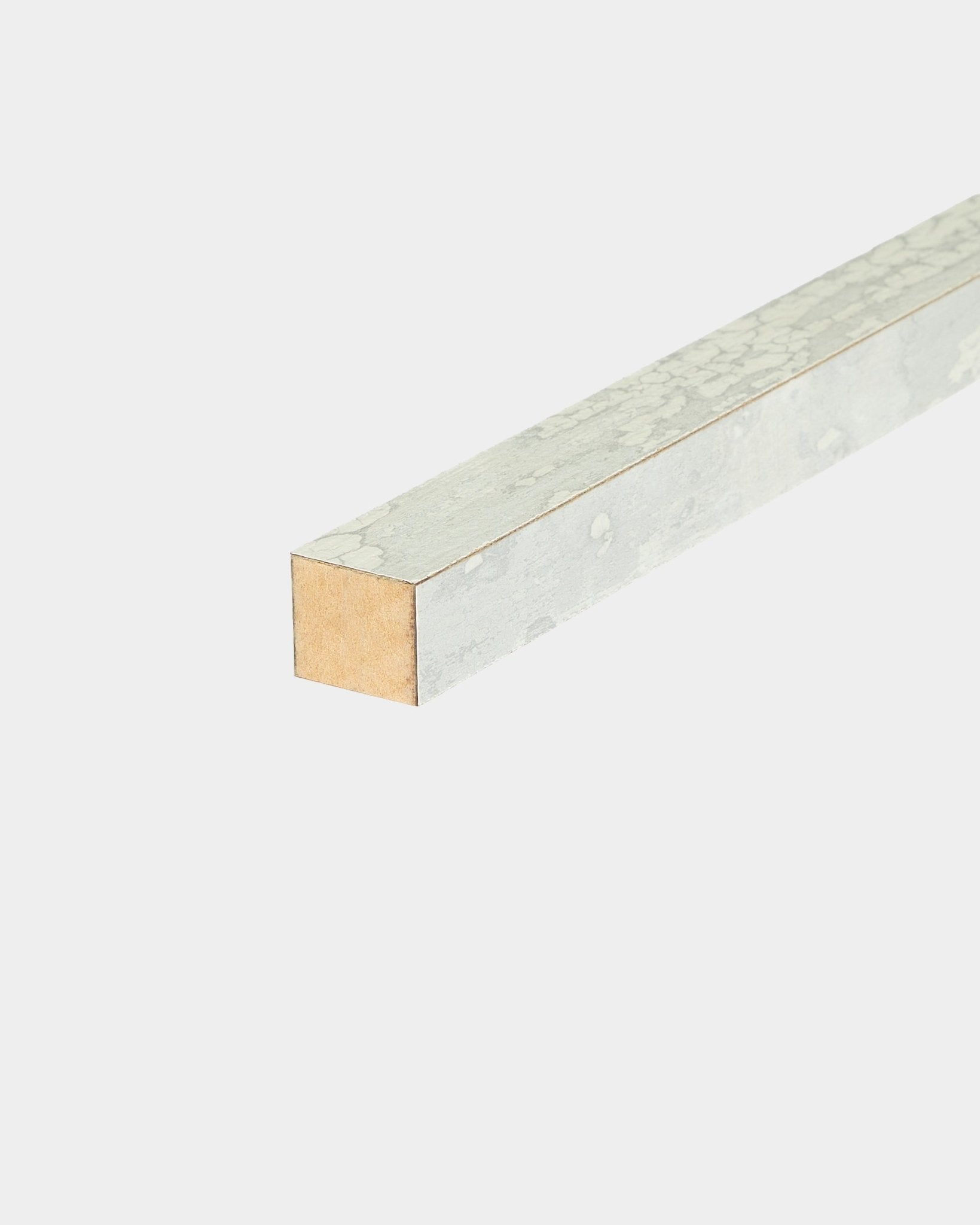 Close-up of WoodUpp End Lamella in Oxide White, 2.2 cm, showing textured coating on three sides for MDF frame installation with acoustic panel systems.