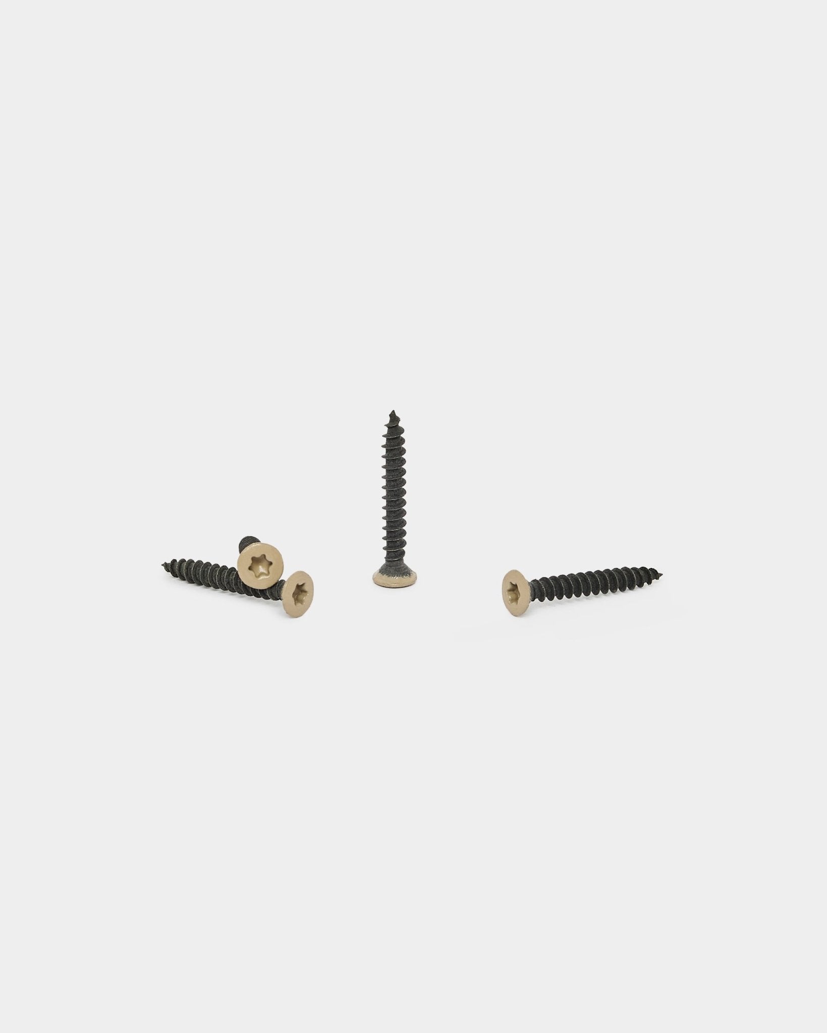 Three beige WoodUpp screws for Akupanel acoustic panel installation, part of the 100-piece Installation Products | Screws set, displayed on a white background.