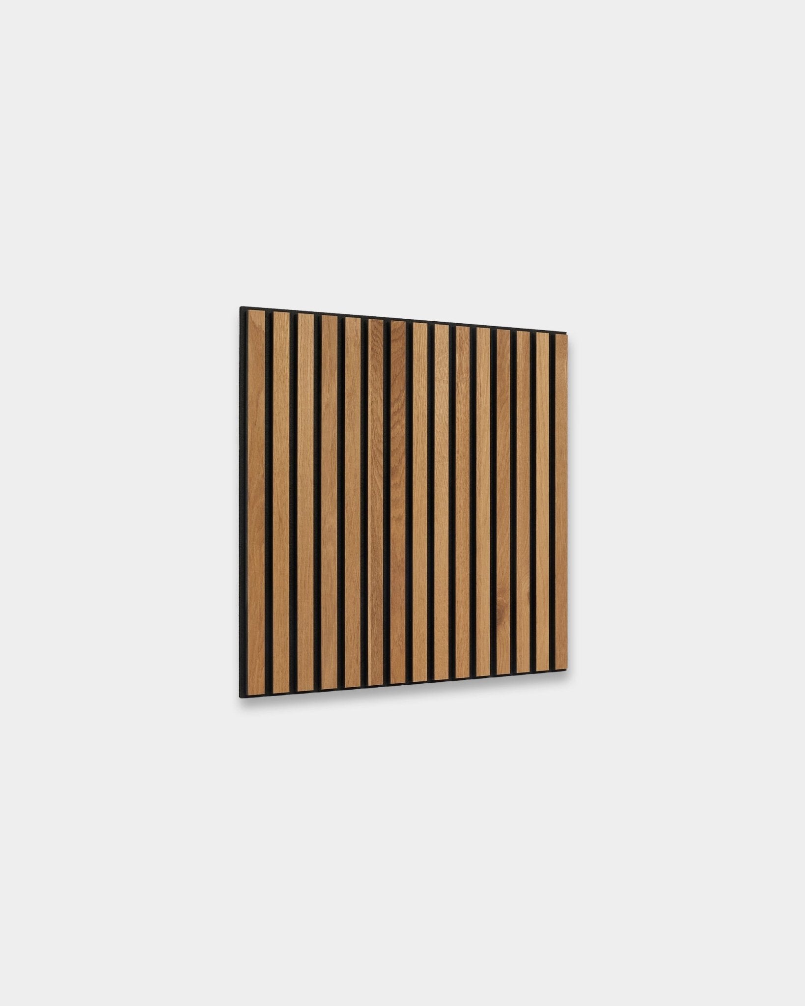 WoodUpp Akupixel Rustic Brown Oak 60x60cm acoustic panel with vertical slats and black gaps, displayed against a light gray Nordic interior wall.