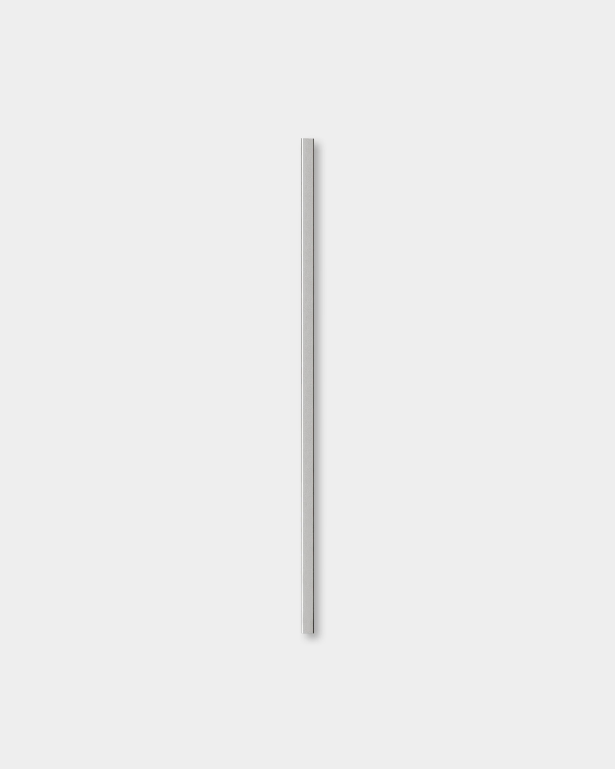 A single Liva polished steel cover, 120 cm tall, by WoodUpp stands vertically against a light gray background, highlighting its modern Nordic design.