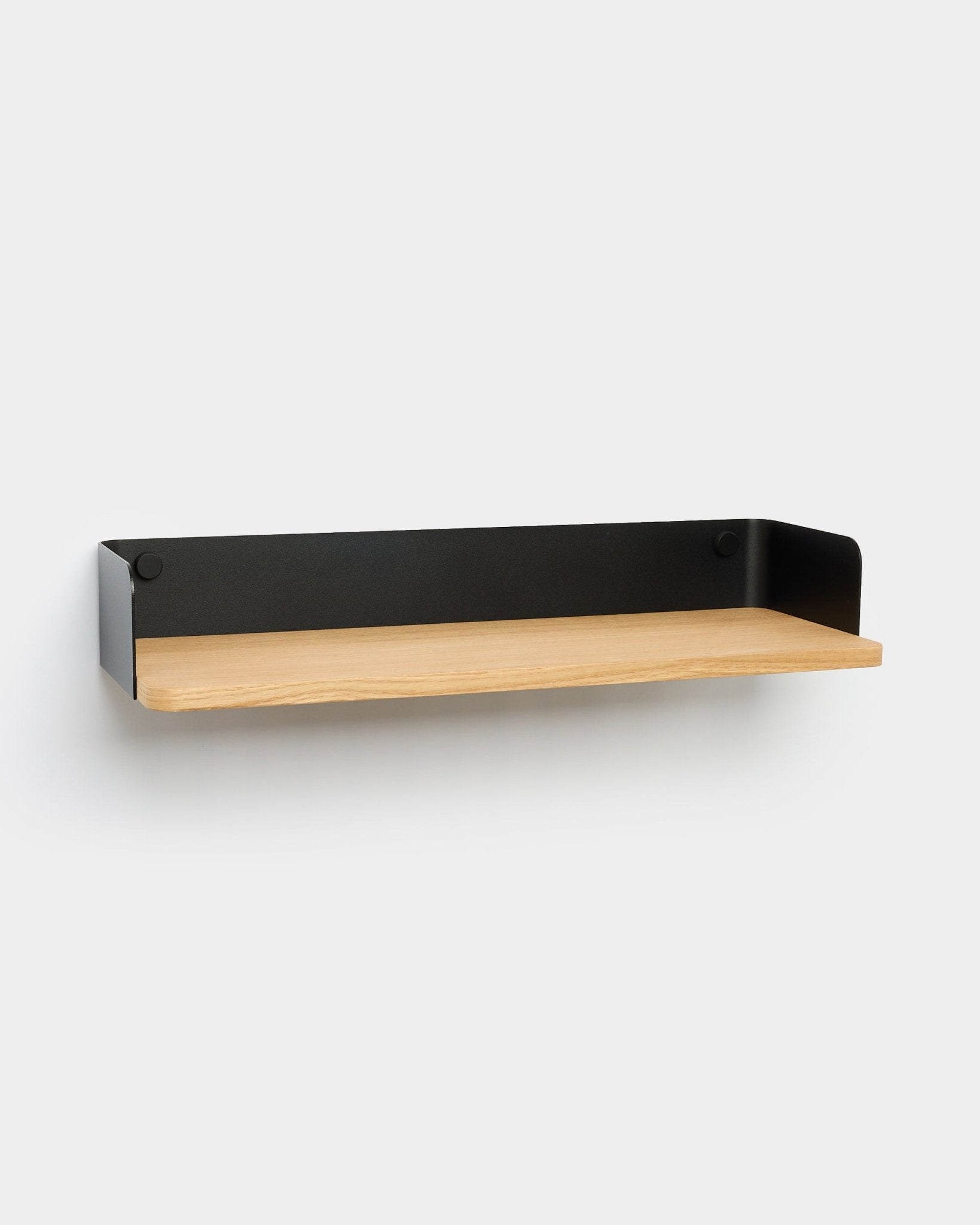 Linn bookshelf by WoodUpp with light wood base and black metal sides, designed in a minimalist Nordic style to complement modern interiors.