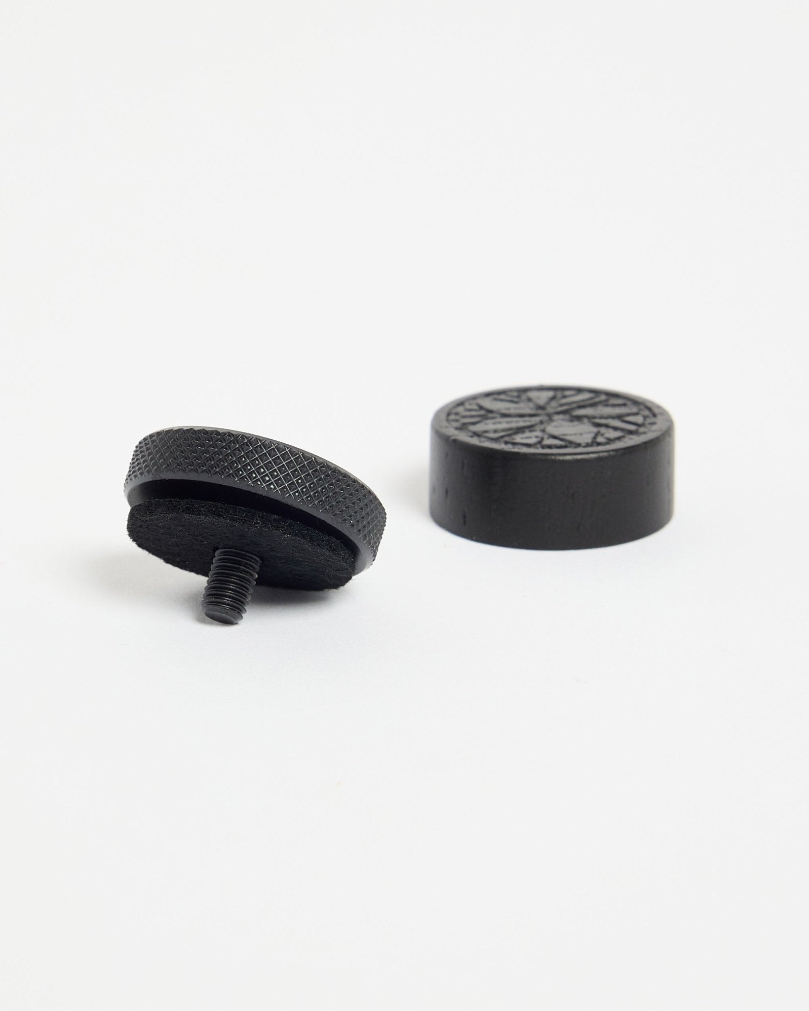 Norr Poster Magnet set in Black Oak from WoodUpp, featuring round black magnets designed for displaying photos or posters on acoustic panels.