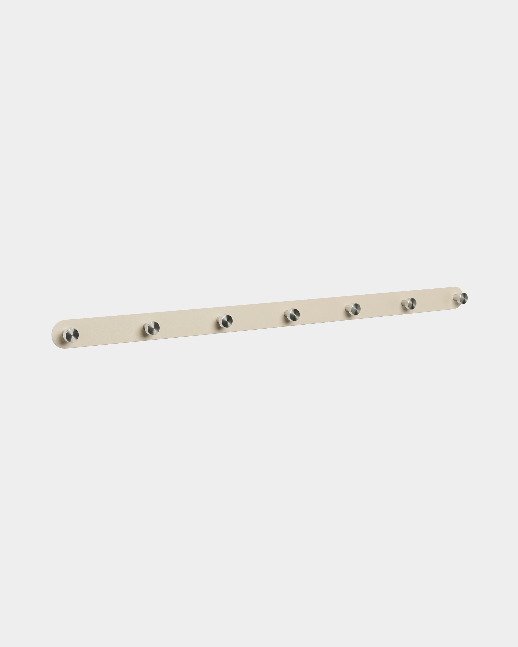WoodUpp Norr Coat Hook Rack in beige and stainless steel with 7 hooks, designed for wall-mounted organization in entryways; minimalist Nordic style.
