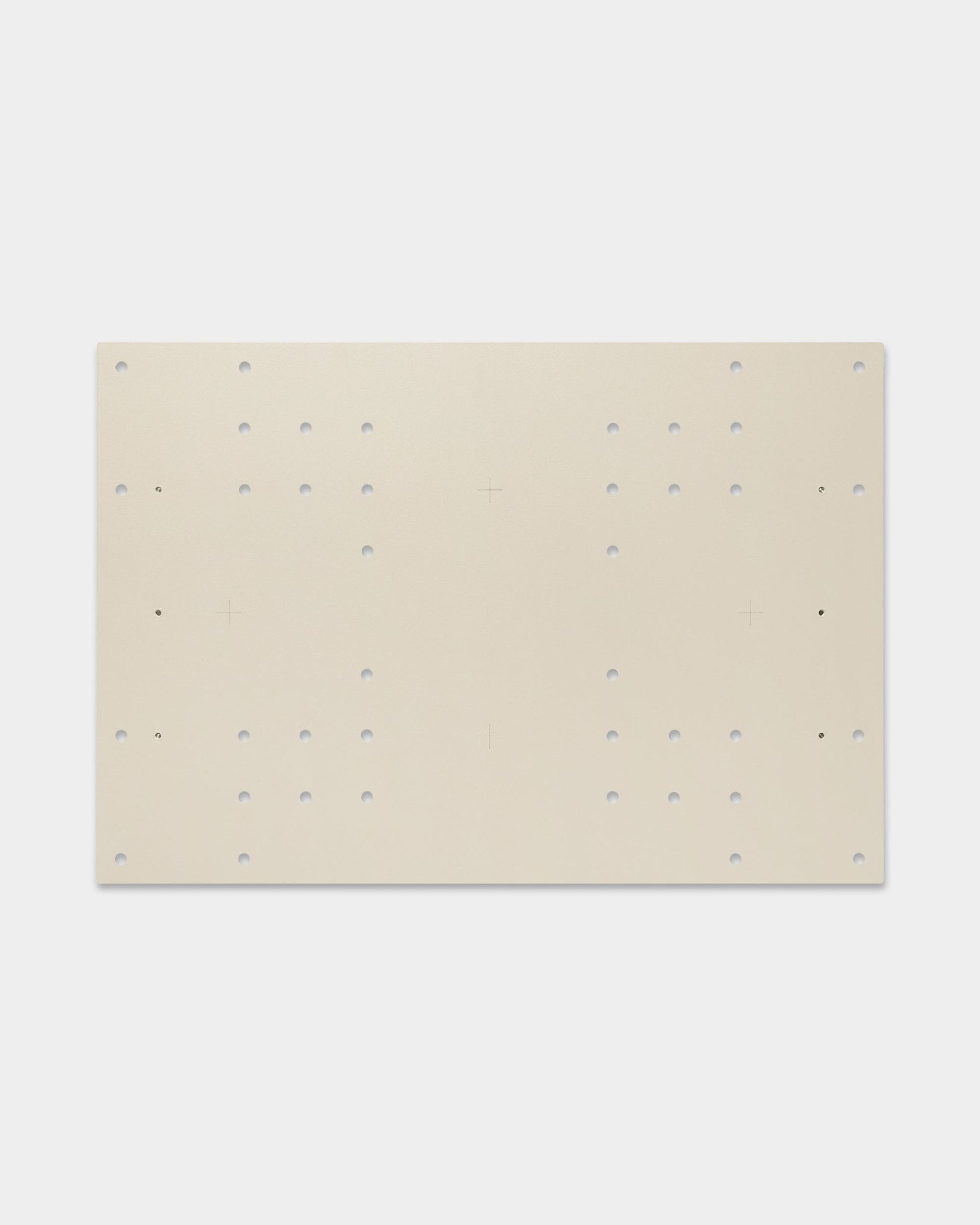 The Nell | TV-Mount / BM1 by WoodUpp is a 64x44 cm beige board for acoustic panels, featuring grid holes and cross marks for flexible mounting options.