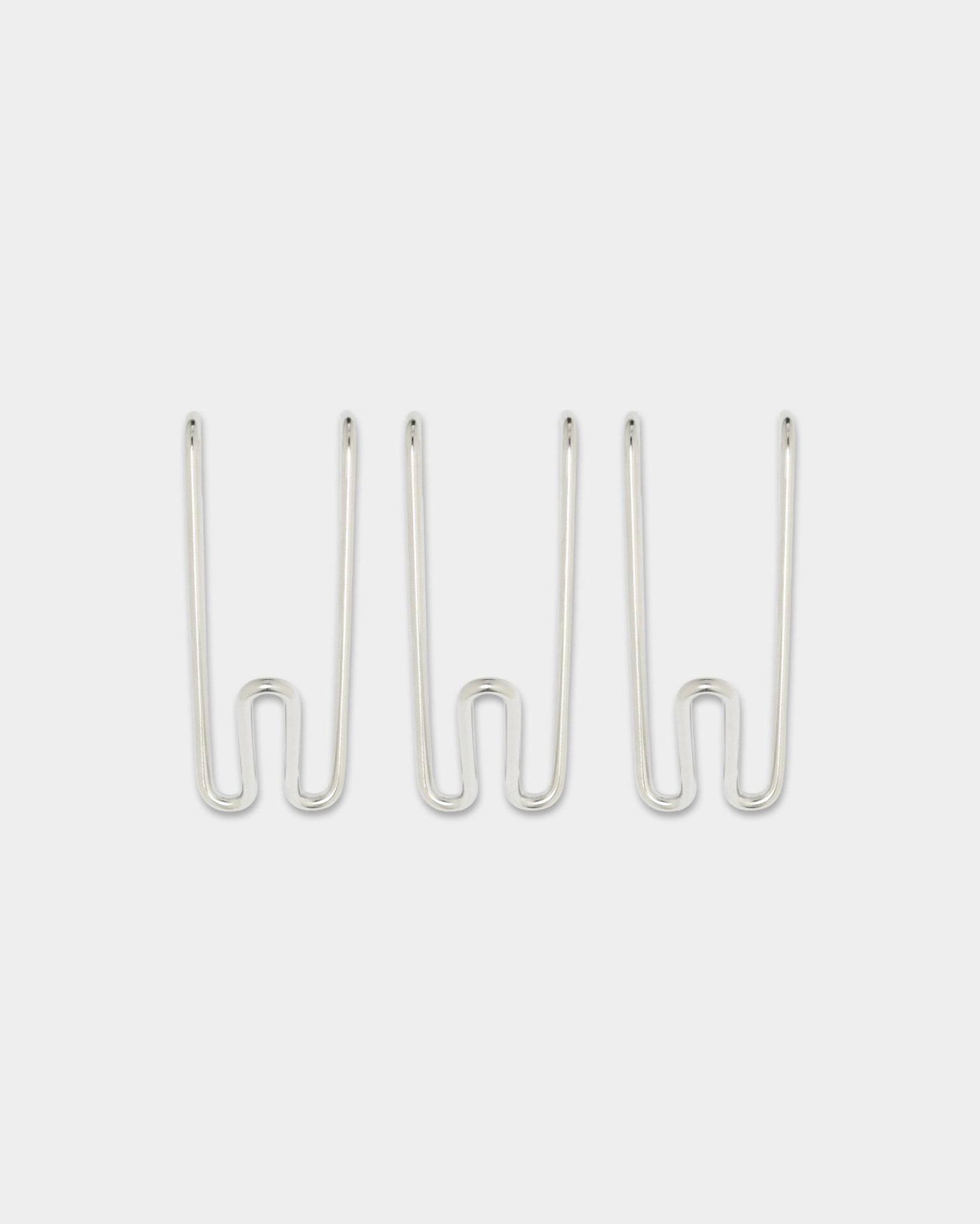 Three Alva Wire Hooks BM1, Short, in stainless steel from WoodUpp’s CREATE collection, evenly spaced on a plain white background.